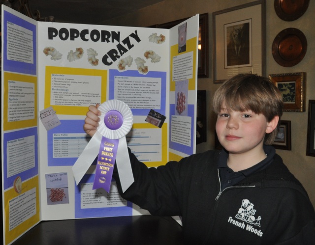 The display that helped Kameron win his school's grand prize ribbon had three data tables -- his display for regionals has five. 