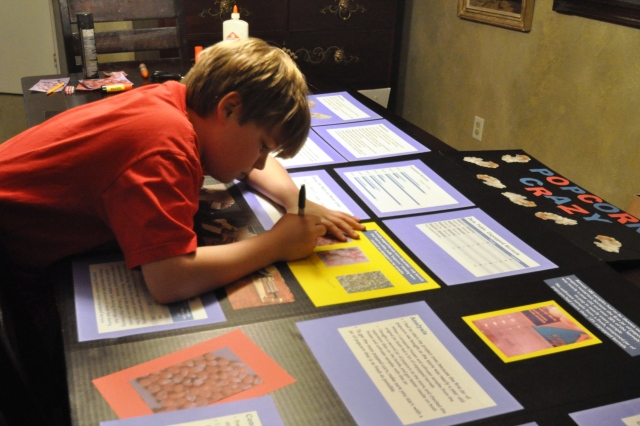 Just to be clear about who does what around here, this is the scene behind me as I post this -- Kameron is finishing his entry for the North Dallas Regional Fair. He already took the 